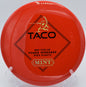 Mint Discs Taco in Apex plastic flying a flat midrange approach shot with controlled fade at Harmony Bends Disc Golf Course in Columbia, Missouri