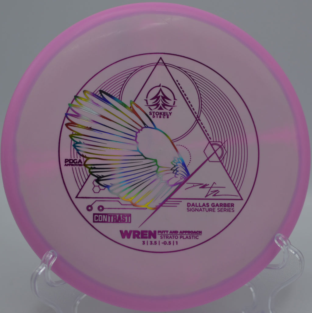 Stokely Discs Contrast Strato Wren floating toward chains on a touch putt at Harmon Hills Disc Golf Course in Fall Branch, Tennessee.