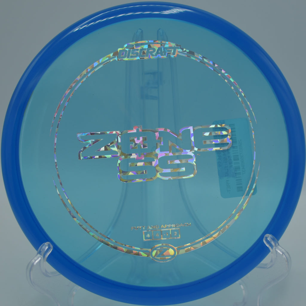 Discraft Z Zone SS carving a smooth turnover shot through tight woods at Sky High Disc Golf Course in Wrightwood, California.