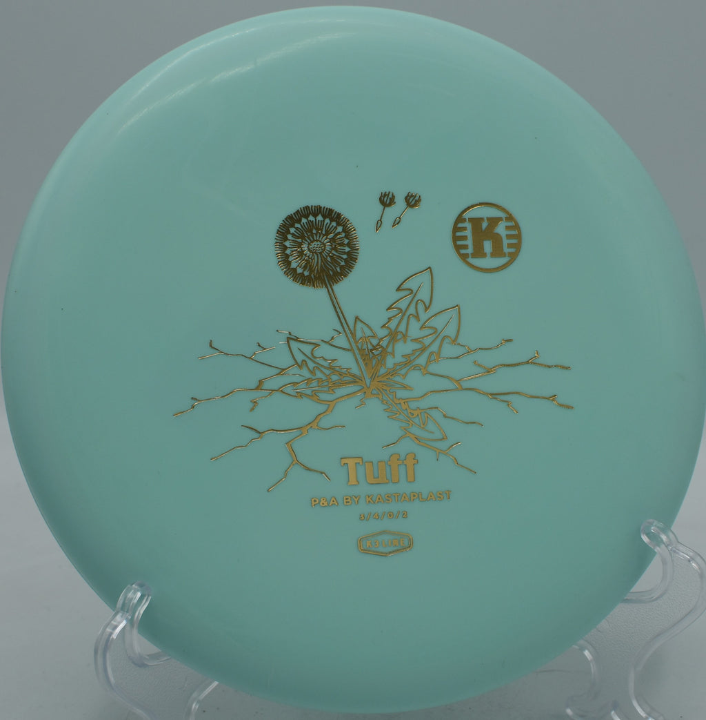 Kastaplast K3 Tuff First Run disc dropping softly under chains at Water Works Park Disc Golf Course in Kansas City, Missouri.