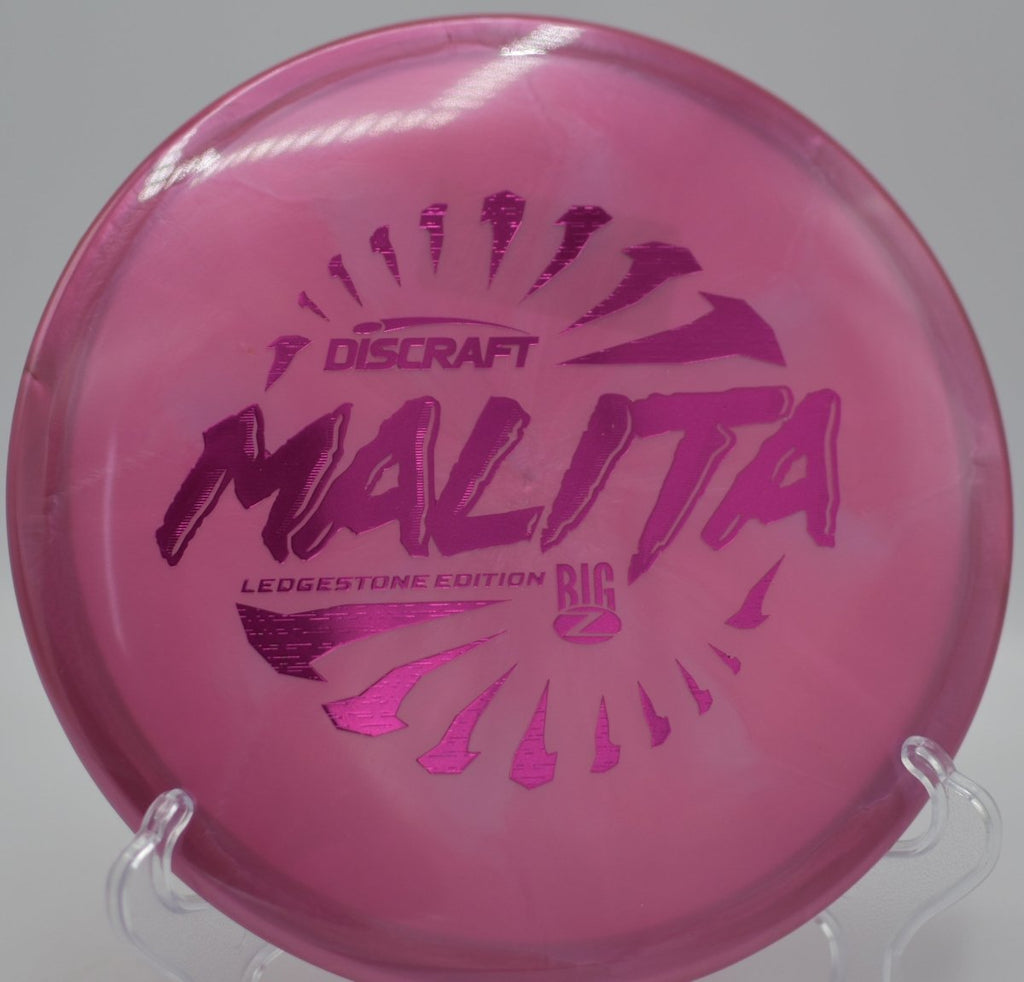 Discraft Big Z Swirl Malita midrange flying laser straight on a placement drive at Pier Park Disc Golf Course in Portland, Oregon