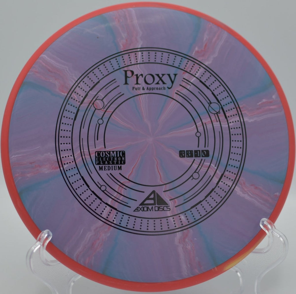 Cosmic Electron Proxy putter catching chains cleanly after a smooth release at Blue Ribbon Pines Disc Golf Course in East Bethel, Minnesota