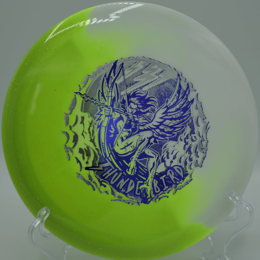 Innova Duo Thunderbird launching down a wooded fairway at Lava Creek DGC in Bend, OR, flipping to flat from hyzer with premium hybrid balance.