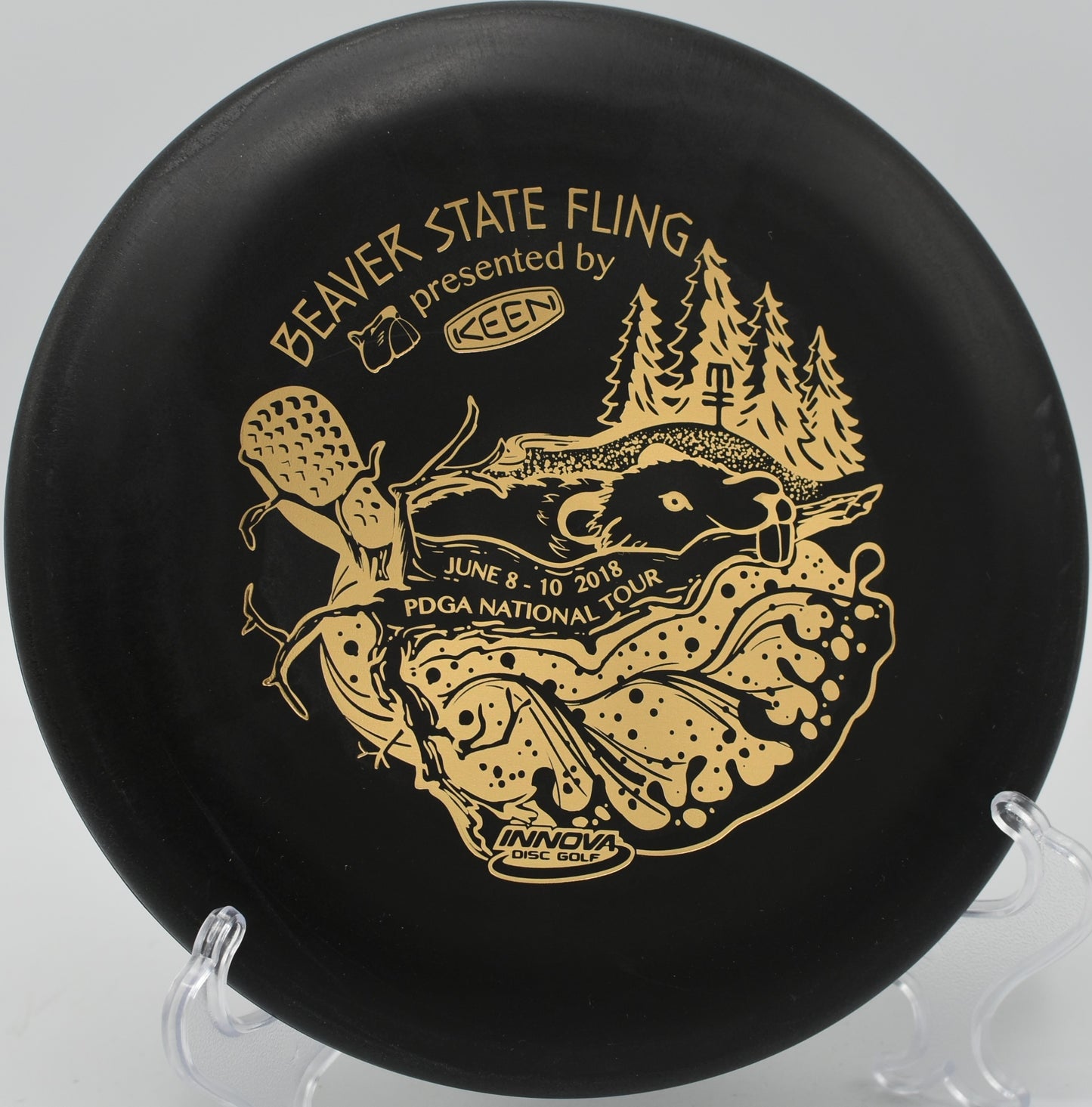 KC Pro Aviar resting near the basket at Brickyard Disc Golf Course in Indianapolis, Indiana.

