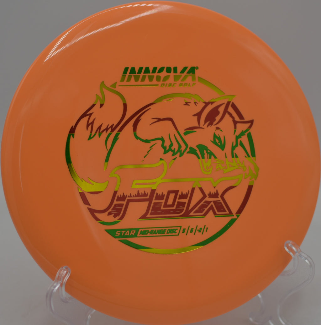 Star Fox by Innova gliding past tree gaps on a calm wind day at Rollin Ridge Disc Golf Course in Reedsville, Wisconsin.