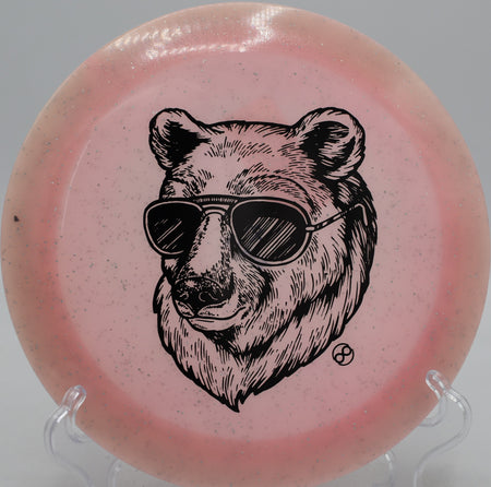 Metal Flake Glow C-Blend X-Out Pharaoh Infinite Discs bomber flying straight with reliable fade at Blue Ribbon Pines Disc Golf Course in East Bethel, Minnesota.