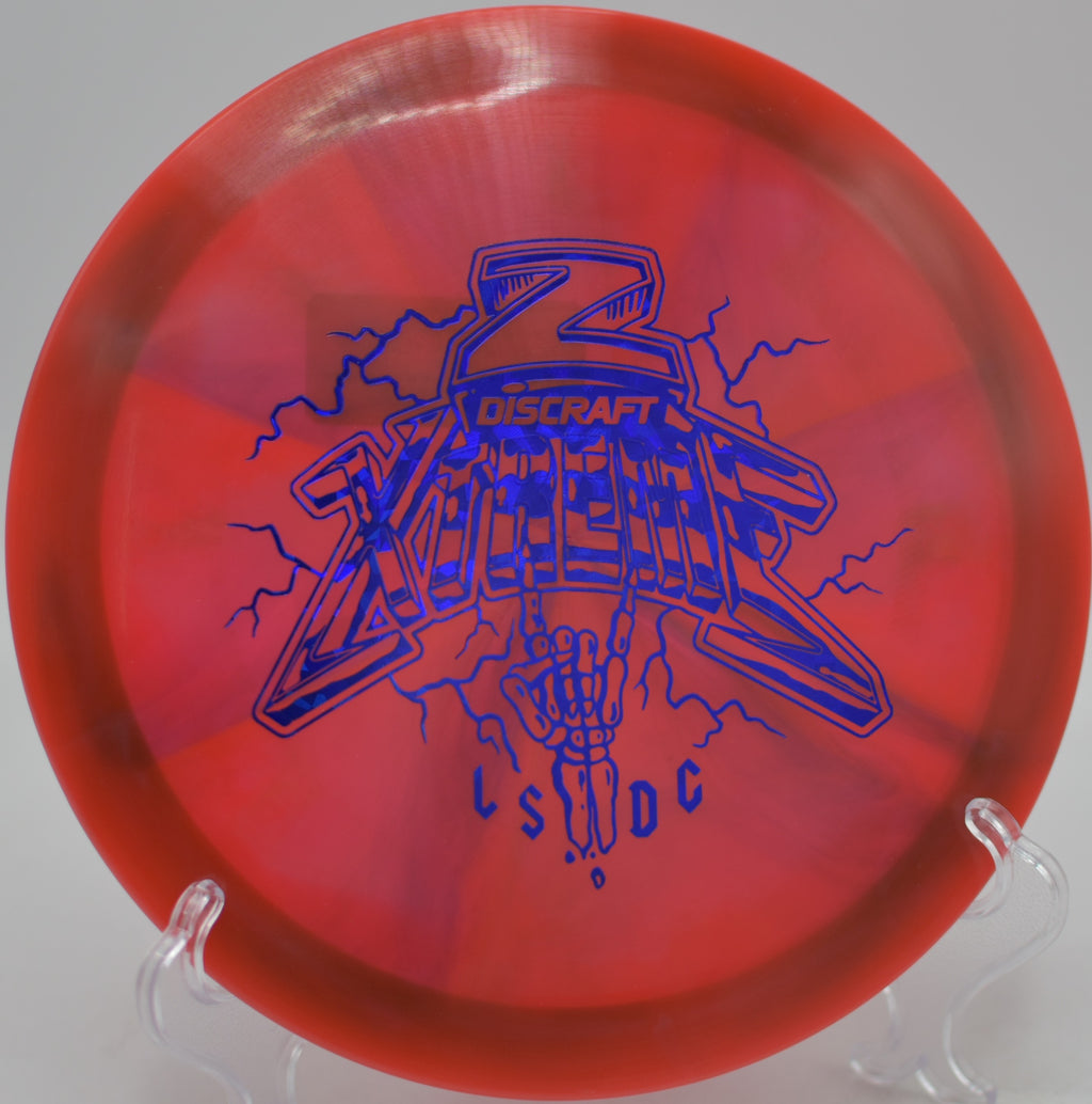 Player gripping the Discraft Xtreme Z Swirl for a controlled forehand approach at Harmon Hills Disc Golf Course in Fall Branch, Tennessee.