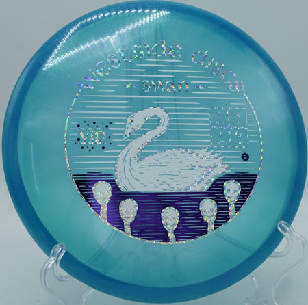 Westside VIP Glimmer Swan putter staged for a spin putt on the green at Lagoon Valley Disc Golf Course in Vacaville, California