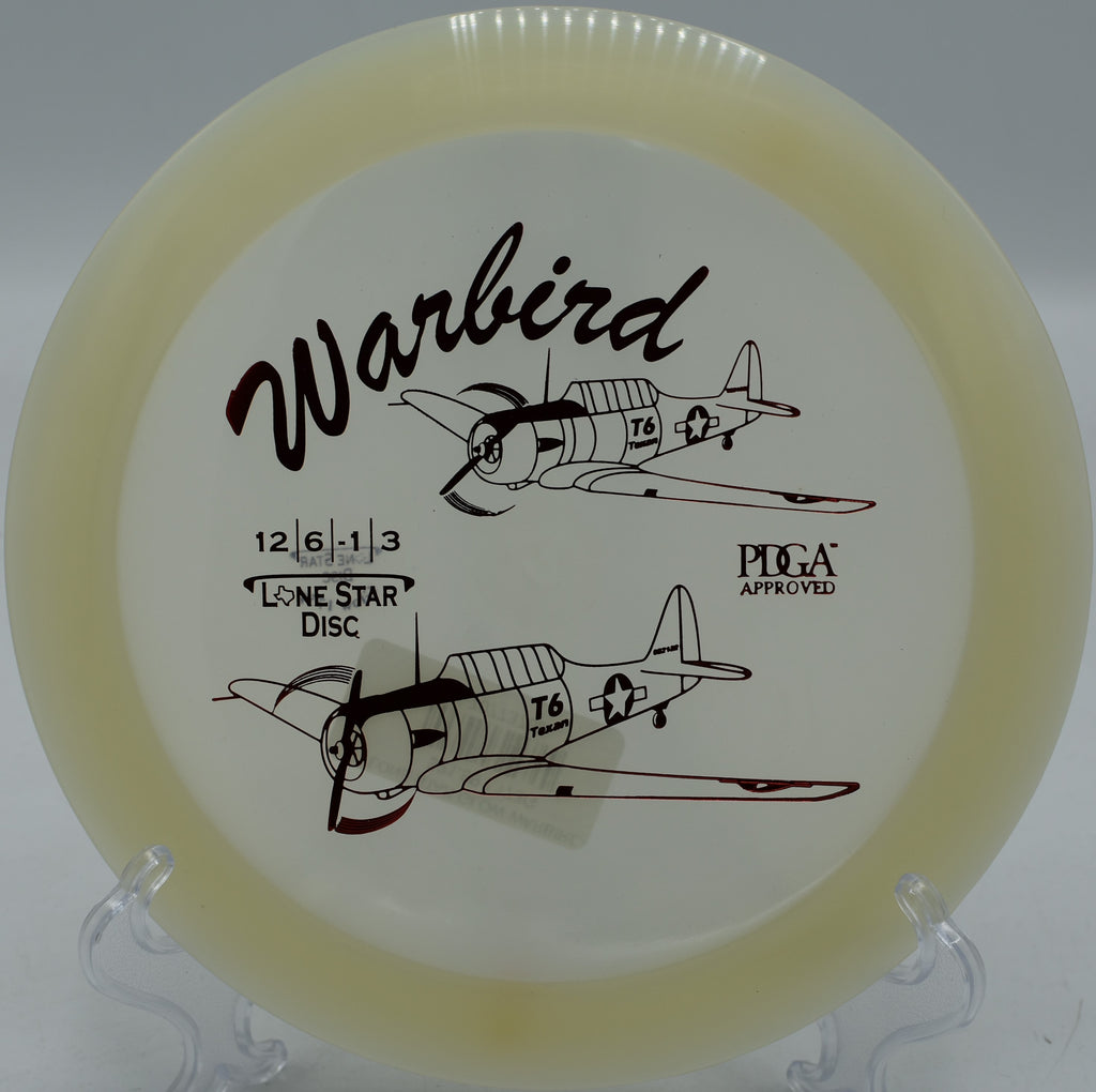 "Glow Warbird disc slicing through the fairway in Portland, Oregon, offering precision and controlled turn in windy conditions."
