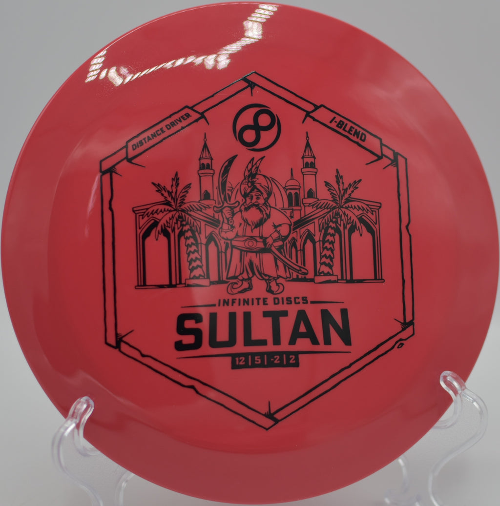 Infinite I-Blend Sultan threading a wooded gap at Woodshed DGC in Paw Paw, WV, holding a laser-straight line off a smooth hyzer-flip.