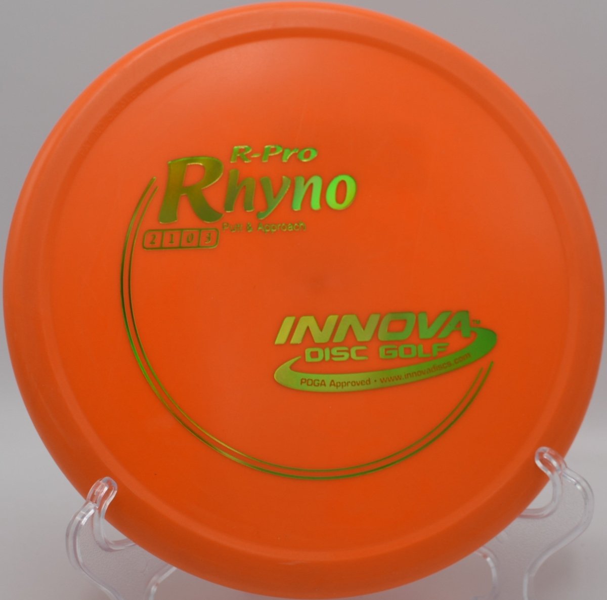 R-Pro Rhyno putter lying beside the basket pole after a forehand approach at Heritage Park Disc Golf Course in Olathe, Kansas