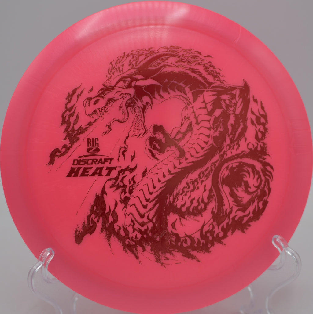 Player launching a Big Z Heat on a controlled hyzer-flip shot at Eagle Island State Park Disc Golf Course in Eagle, Idaho.