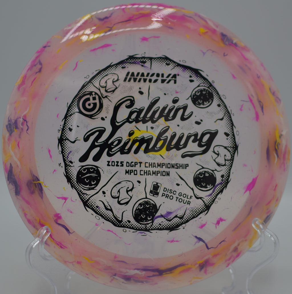 Brightly colored Party Time Destroyer streaking over water at Indian Hammocks Park Disc Golf Course in Miami, Florida.