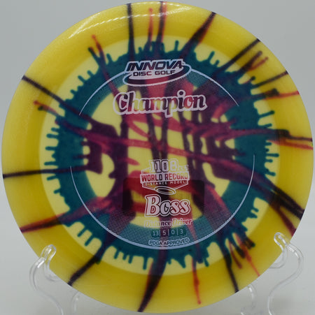 Innova I-Dye Boss mid-flight during a headwind crush at Bucksnort Disc Golf Course in Pine, Colorado