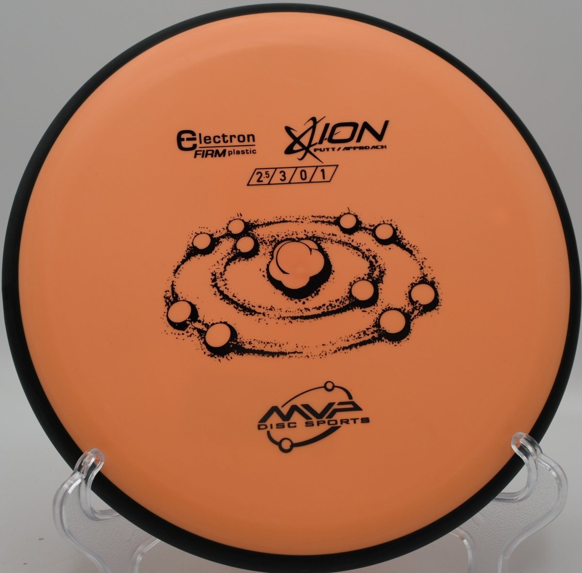 MVP Electron Firm Ion putter staged for a spin putt on the green at Hap McLean Park Disc Golf Course in Fort Walton Beach, Florida