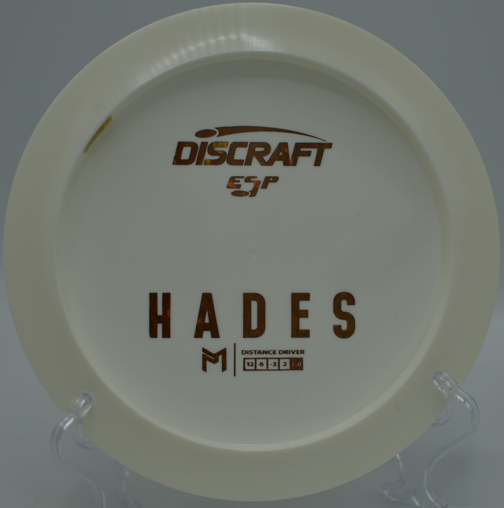 Discraft ESP Hades carving a controlled turnover shot through the pines at Pioneer Park Disc Golf Course in Billings, Montana.