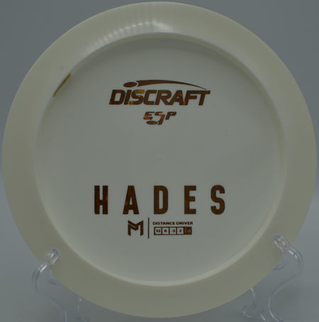 Discraft ESP Hades carving a controlled turnover shot through the pines at Pioneer Park Disc Golf Course in Billings, Montana.