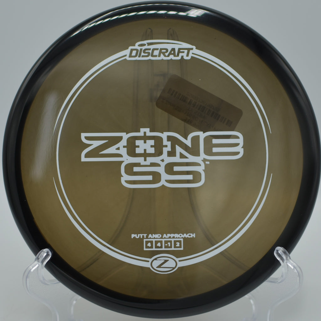 Discraft Z Zone SS flying flat over open terrain at Auburn Regional Park Disc Golf Course in Auburn, California.