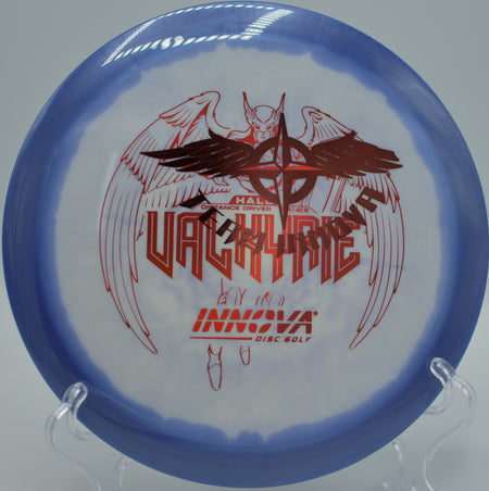 Player throwing a Halo Star Valkyrie Team Stamp on a smooth hyzer-flip line at Maple Hill Disc Golf Course in Leicester, Massachusetts.