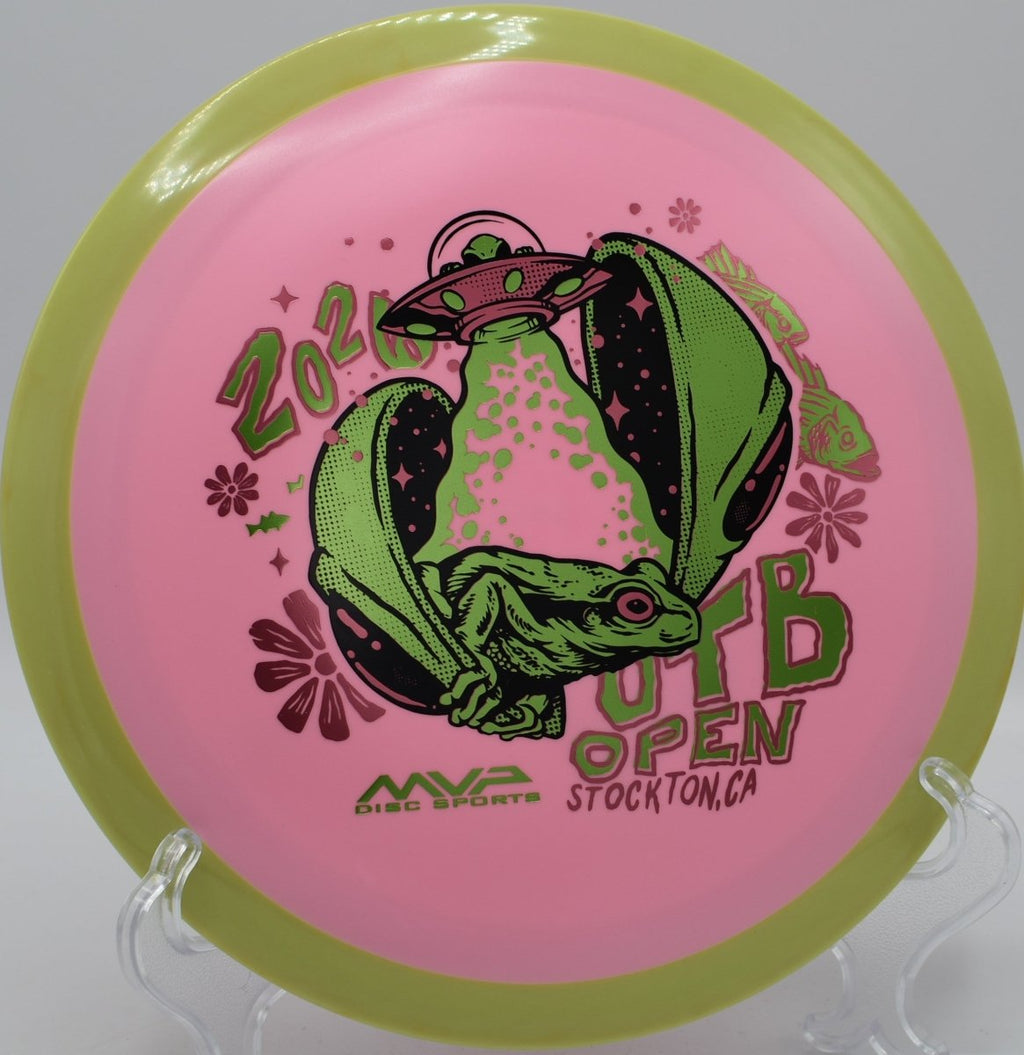 2026 OTB Open Fission Delirium distance driver sitting beside tee marker at Pier Park Disc Golf Course in Portland, Oregon