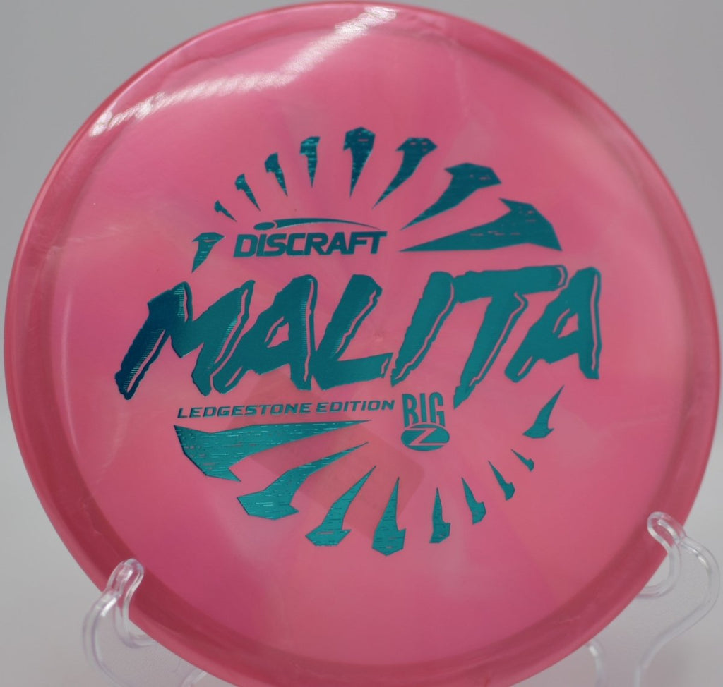 2026 Ledgestone Big Z Swirl Malita midrange executing a smooth turnover at Rollin Ridge Disc Golf Course in Reedsville, Wisconsin