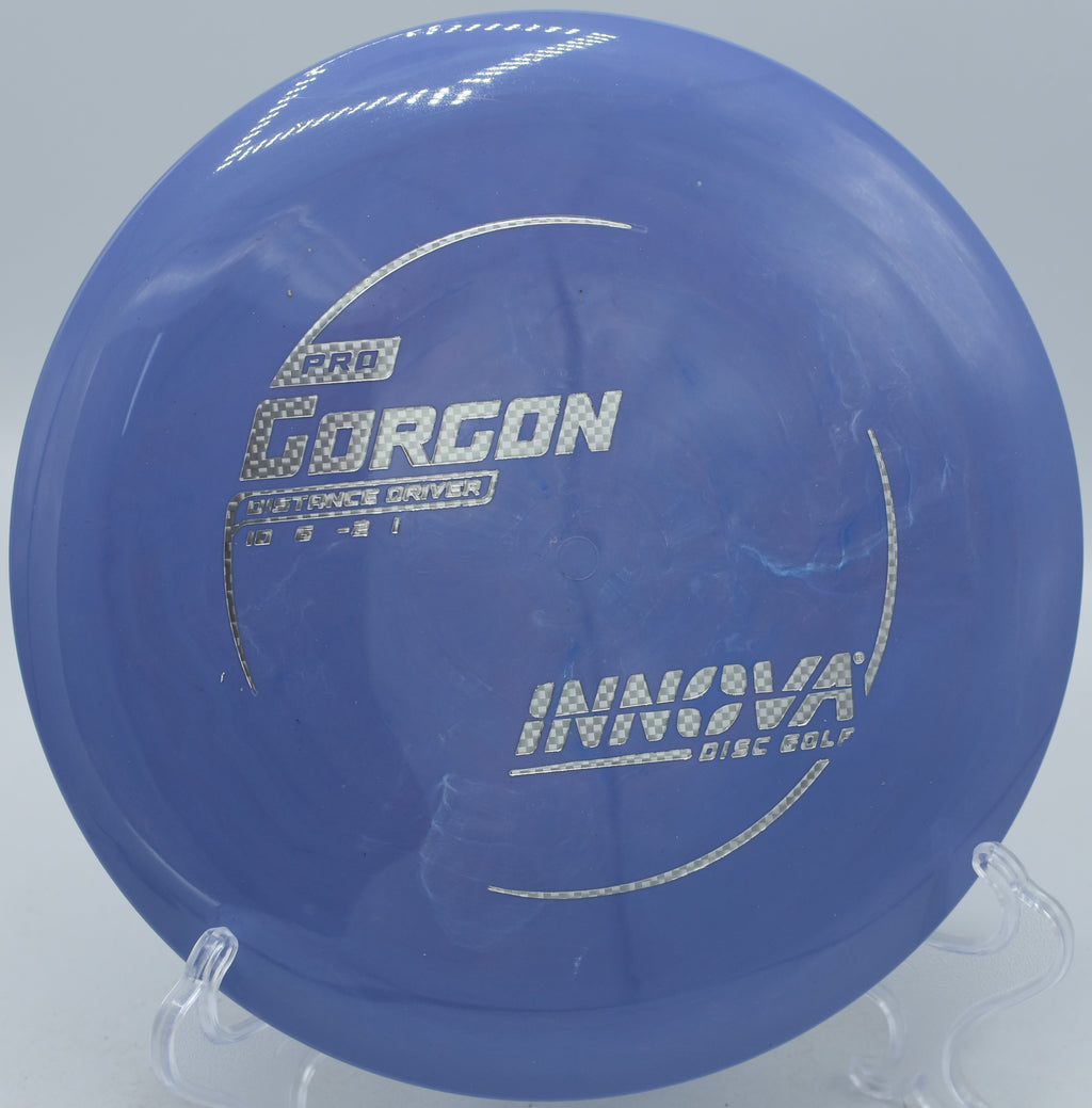 An Innova Pro Gorgon soaring down the open fairway at Sunset Park Disc Golf Course in Las Vegas, Nevada, on a controlled distance drive.