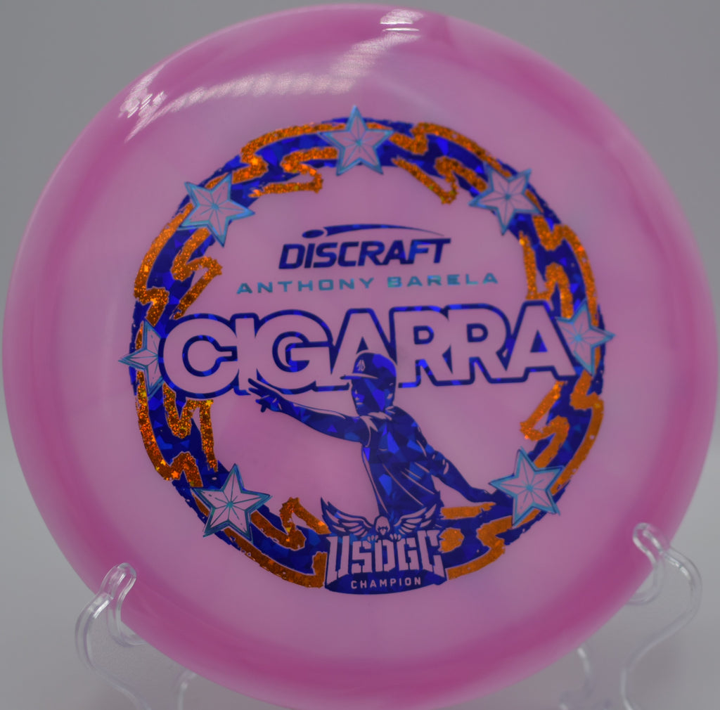 Discraft Cigarra in Z-Swirl plastic placed on the fairway at Bald Mountain DGC in Lake Orion, MI, ideal for technical straight shots.