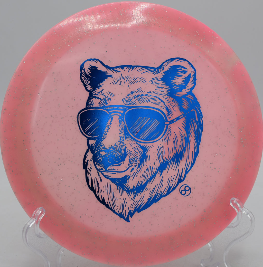 Infinite Discs Metal Flake Glow C-Blend X-Out Pharaoh glowing distance driver parking circle one at DeLaveaga Disc Golf Course in Santa Cruz, California.