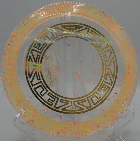 Brightly speckled Confetti Z Zeus disc staged on the tee pad at Lake Marshall Lions Course in Montross, Virginia