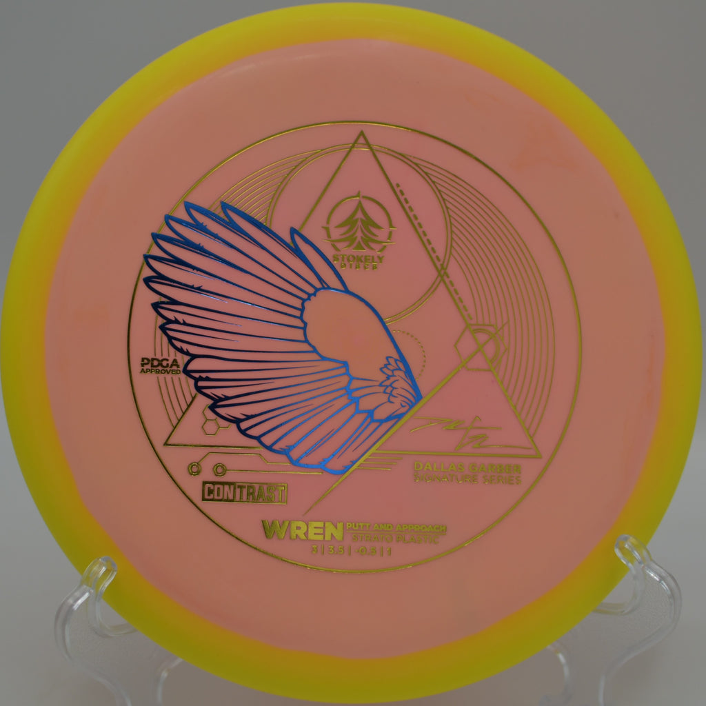 Stokely Discs Strato Wren landing flat beside the pin after a soft approach at Rotary Park Disc Golf Course in Johnson City, Tennessee.