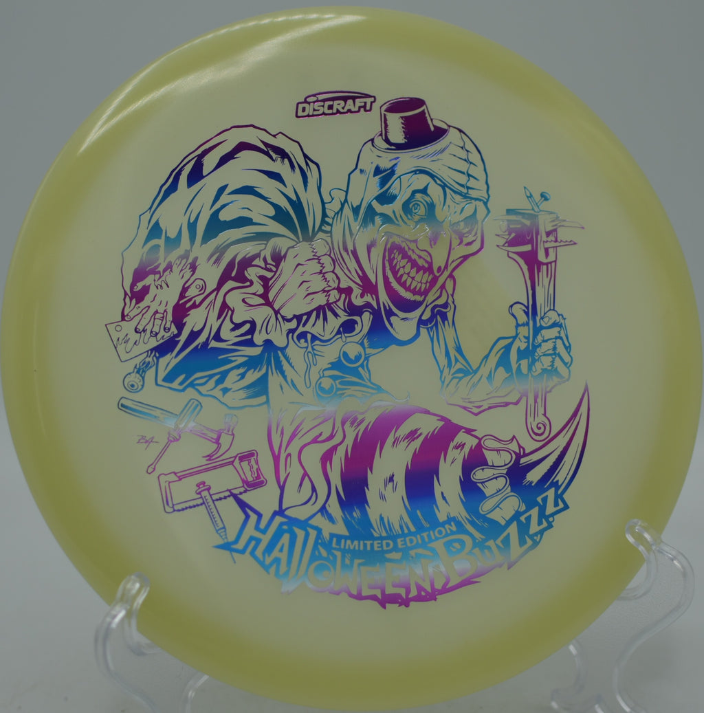 Halloween 2025 Mega Glo Buzzz single stamp landing softly at West Thompson Lake Disc Golf Course in North Grosvenordale, Connecticut.
