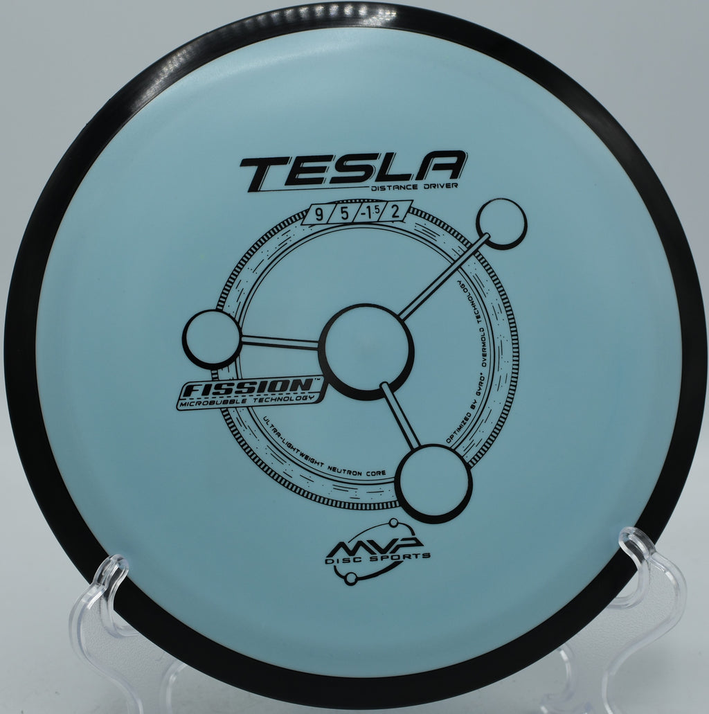 MVP Fission Tesla gliding down a tight wooded tunnel at Wickham Park Disc Golf Course in Manchester, Connecticut.