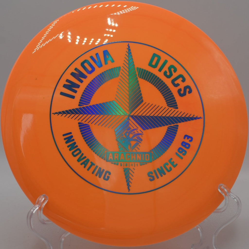 Innova Protostar Arachnid midrange parked near cage after a precision upshot at Greenbelt Park Disc Golf Course in Clovis, New Mexico