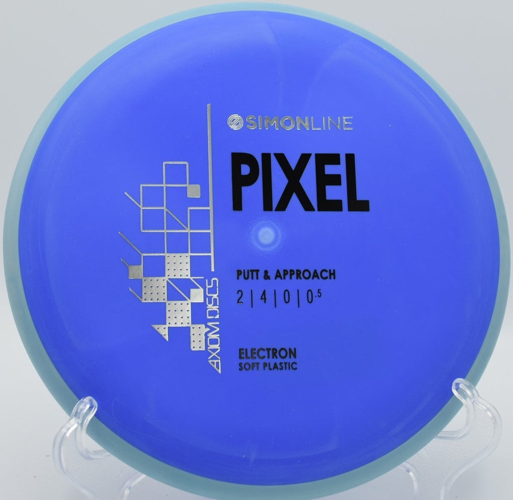 Electron Soft Pixel putter resting under basket chains after a clean putt at Swan Creek Park Disc Golf Course in Toledo, Ohio