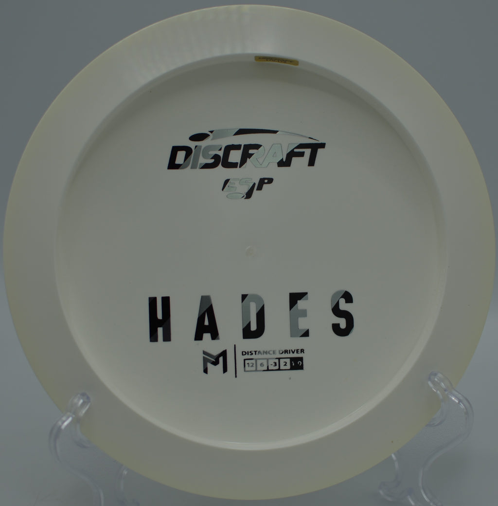 Player launching a full-power ESP Hades drive across mountain air at Highland Glen Disc Golf Course in Bozeman, Montana.