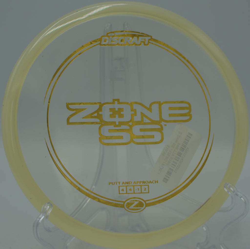 Discraft Z Zone SS approach disc flying straight at Flip City Disc Golf Park in Shelby, Michigan.