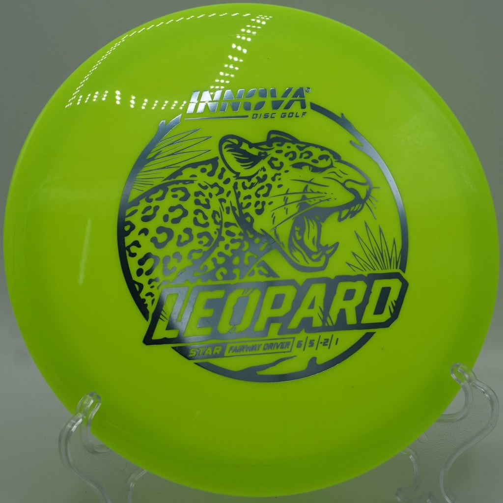 Innova Star Leopard fairway driver ripping a smooth hyzer flip down wooded fairway at Westside Park Disc Golf Course in Rocky Face, Georgia