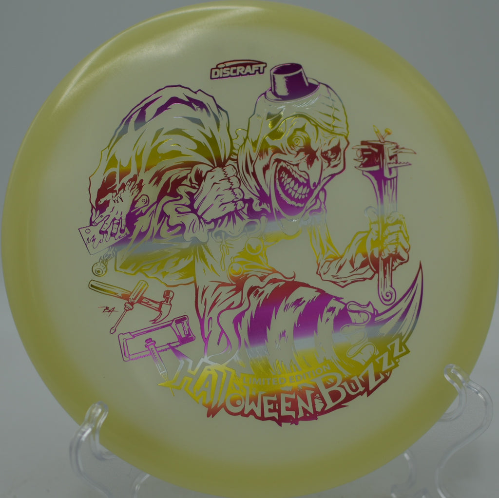Discraft 2025 Mega Glo Halloween Single Stamped Buzzz flying flat and glowing at Oak Grove Disc Golf Course in Pasadena, California.