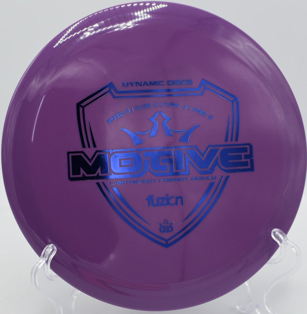 Dynamic Discs Fuzion Motive lightweight driver holding glide forward at Blue Ribbon Pines Disc Golf Course Minnesota