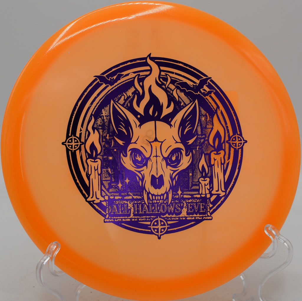 Innova Proto Glow Champion Fox disc launched on a wooded tunnel shot at North Cove Disc Golf Course in Marion, North Carolina