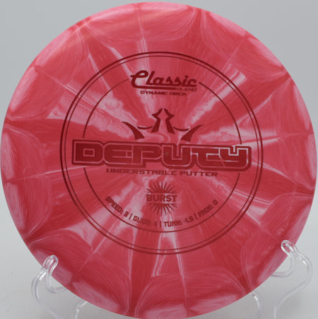 Dynamic Discs Classic Blend Burst Deputy straight-flying putter sinking putts at Maple Hill Disc Golf Course in Leicester, Massachusetts.