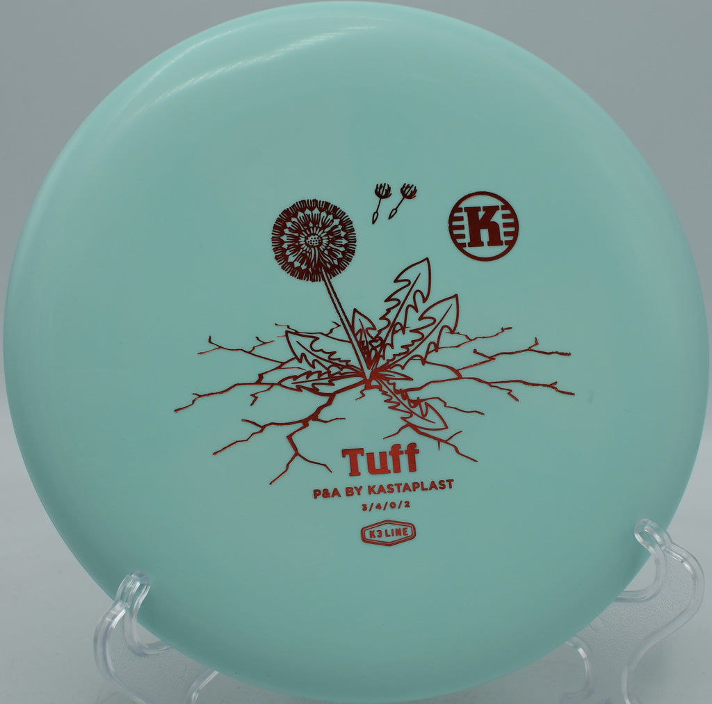 Kastaplast K3 Tuff First Run durable base plastic putter settling beside the pin at Winthrop Gold Disc Golf Course in Rock Hill, South Carolina.