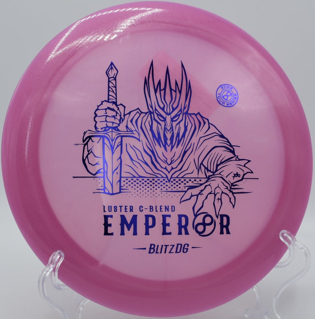 Luster C-Blend Emperor driver flying through wooded gap on distance line at Diavolo Disc Golf Course in Cary, North Carolina