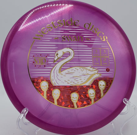 VIP Glimmer Swan understable putter resting near chains after a soft anhyzer upshot at Indian Camp Creek Disc Golf Course in Foristell, Missouri