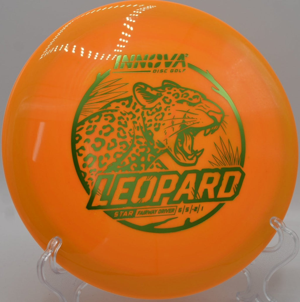Star Leopard fairway driver gliding on a long turnover line through tight trees at Green Valley Park Disc Golf Course in Payson, Arizona