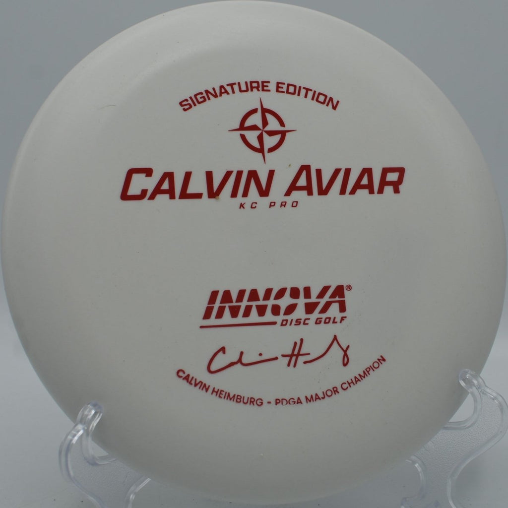 KC Pro Aviar putter resting near chains after a glidey upshot at The Canyons Disc Golf Course in Lockport, Illinois