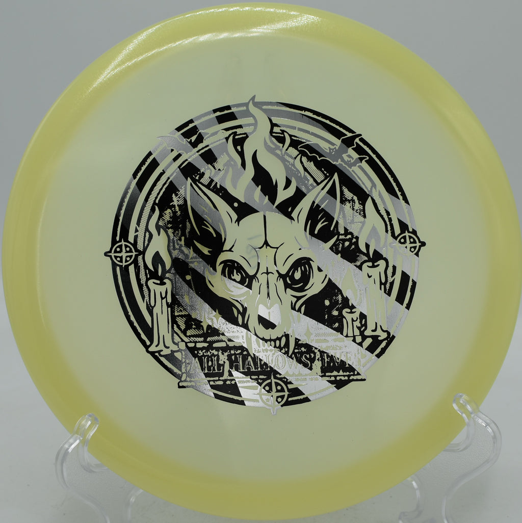 Proto-Glow Champion Fox Innova glow midrange parked on tight fairways at Osage Grove Disc Golf Course in Goshen, Ohio.