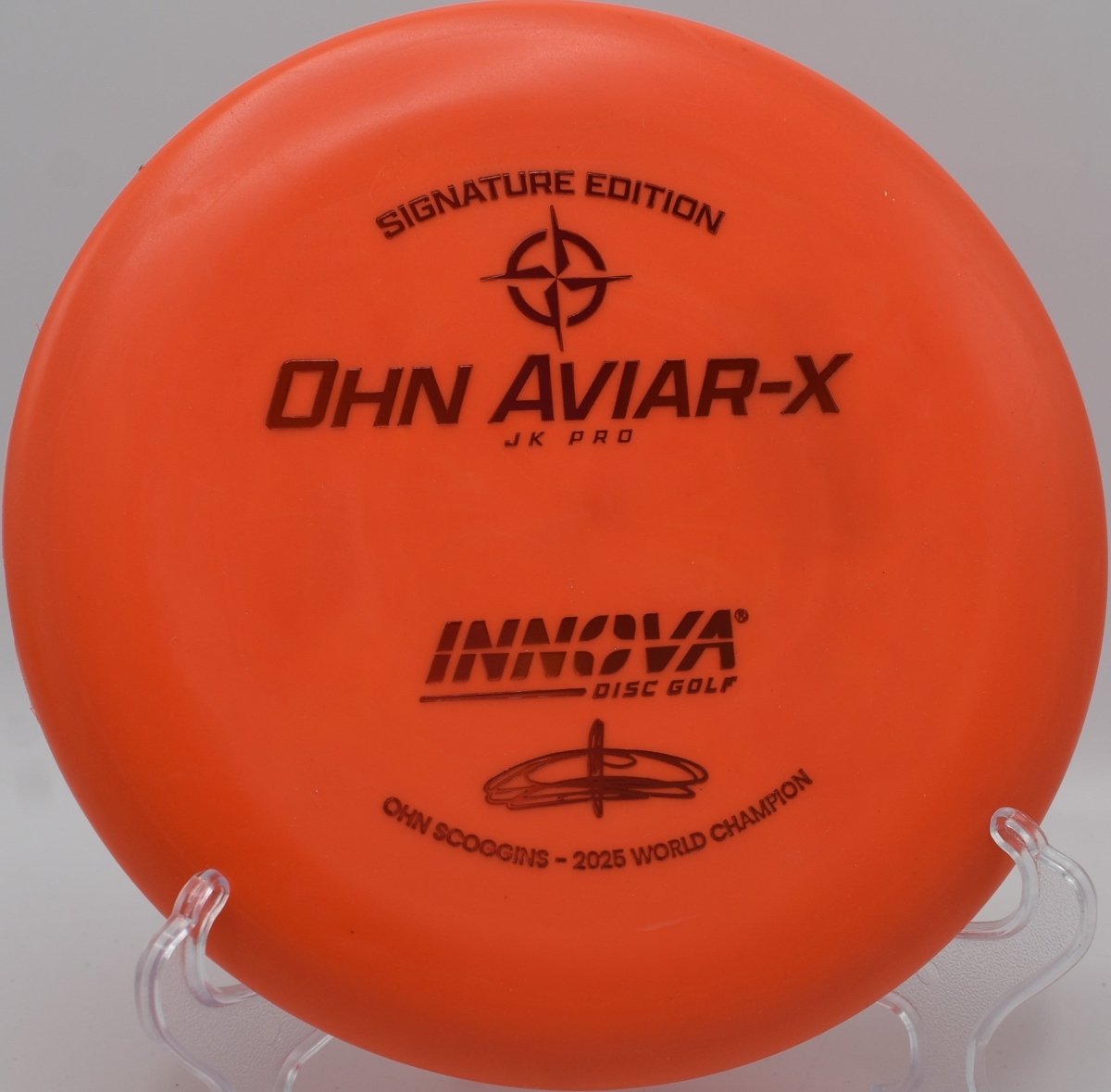 Innova JK Aviar-X putter staged for a spin putt on the green at Hudson Mills Original Disc Golf Course in Dexter, Michigan