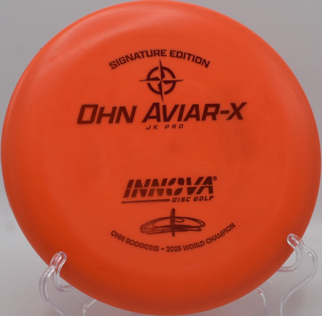 Innova JK Aviar-X putter staged for a spin putt on the green at Hudson Mills Original Disc Golf Course in Dexter, Michigan
