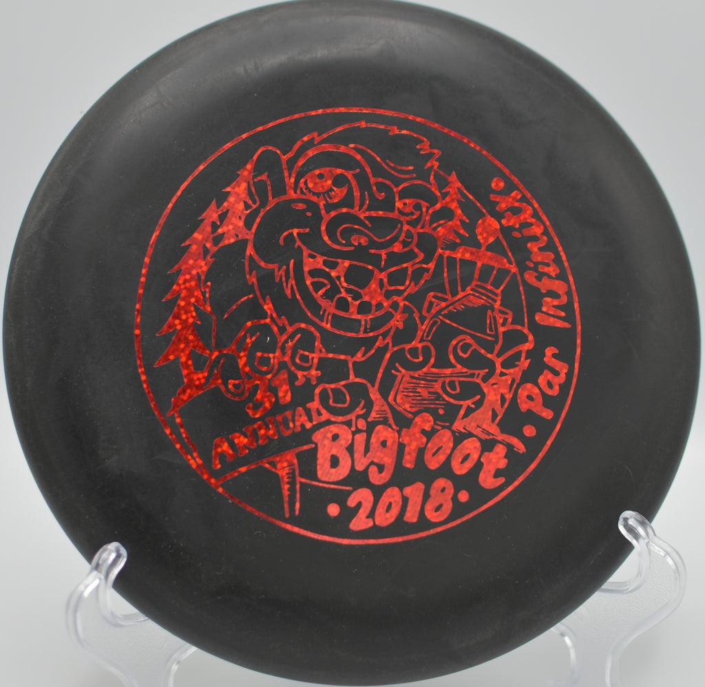 DX Big Bead Aviar parked beside the basket after a straight putt at Fort Steilacoom Disc Golf Course in Tacoma, Washington.